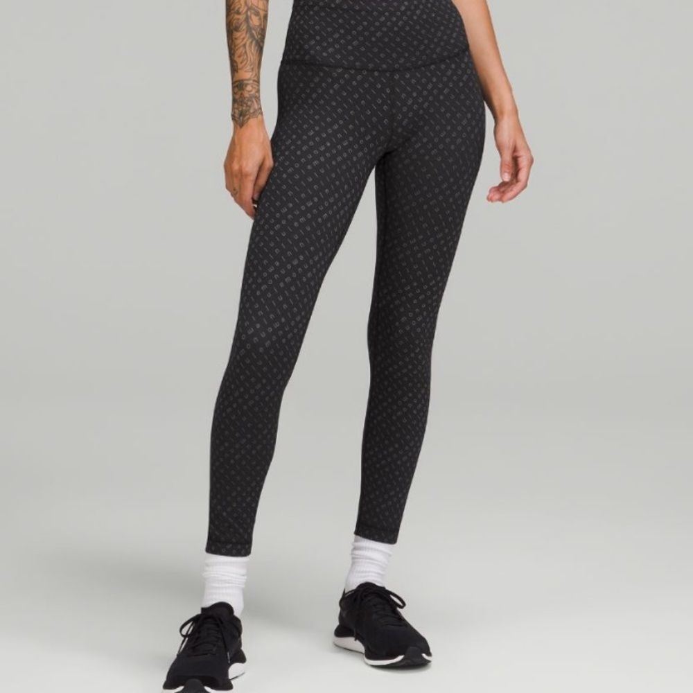 Lululemon ~ Wunder Train High Rise Tight 25” ~ sz 0 ~ black with grey lettering